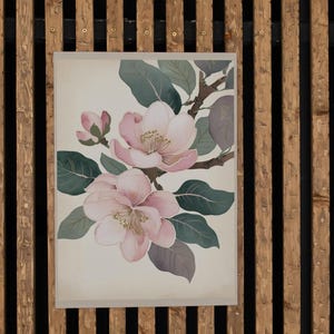 以下が含まれることがあります： 白い背景に、ピンクの花が2つと緑の葉が描かれた水彩画の額装プリントです。