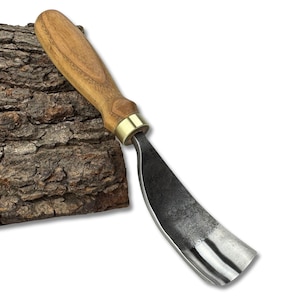 May include: A curved wood carving gouge with a wooden handle and a brass ferrule. The blade is made of dark metal and has a curved shape. The gouge is designed for woodworking and carving projects.