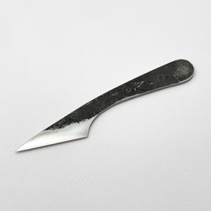 Hand-forged kiridashi on white background, steel Japanese marking knife.