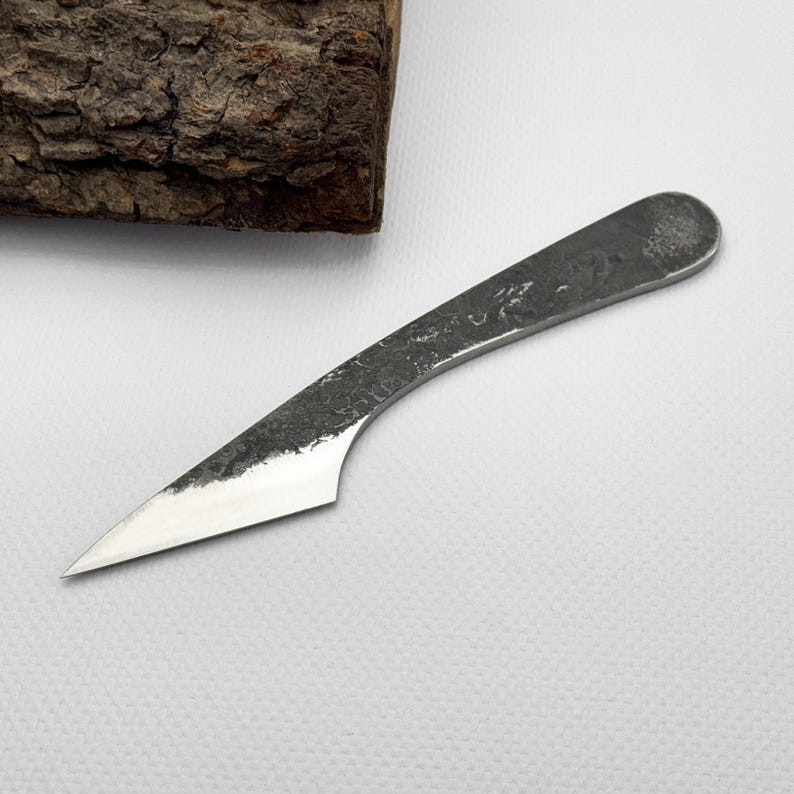 Kiridashi edge-down near bark, 52100 steel for precise marking and skiving.