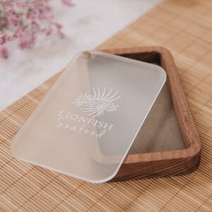 Wood and acrylic payment box with laser-engraved logo for restaurants or hotels. Available in a variety of finishes.