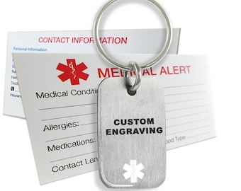 May include: A silver medical alert keychain with a red star of life and the text "CUSTOM ENGRAVING". The keychain is attached to a silver key ring. The keychain is next to a white medical alert card with the text "MEDICAL ALERT" and lines for writing.