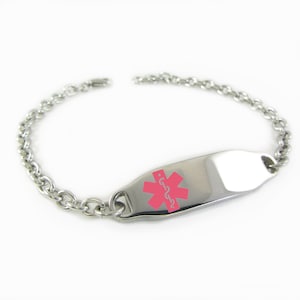 May include: A silver medical ID bracelet with a pink star of life symbol and the word "حساسية" in white. The bracelet has a chain link design.