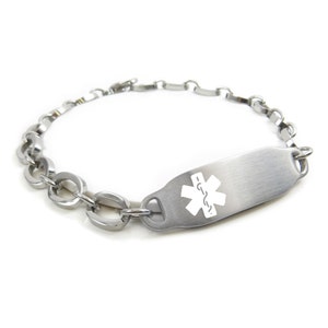 May include: A silver medical alert bracelet with a chain link design and a rectangular tag engraved with a white star of life symbol.
