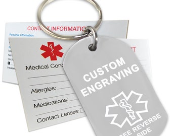 May include: A silver medical alert keychain with a white star of life symbol and the text "CUSTOM ENGRAVING" and "SEE REVERSE SIDE". The keychain is attached to a silver key ring.