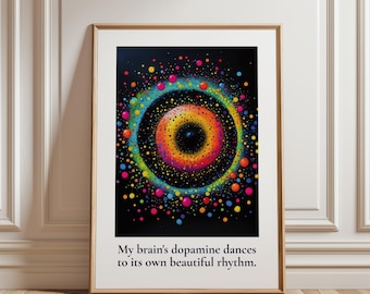 May include: A framed wall art print featuring a black background with a vibrant, multicolored circular pattern of dots resembling a galaxy or eye. Below the graphic, the text reads: My brain's dopamine dances to its own beautiful rhythm.