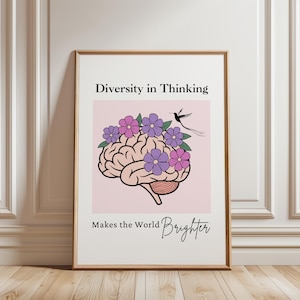 May include: Framed art print with a brain illustration decorated with purple and pink flowers, and a small black bird. The text reads "Diversity in Thinking Makes the World Brighter" on a light pink background.