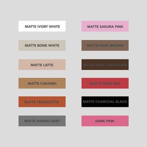 May include: A color chart with 12 different shades of paint. The colors include ivory white, bone white, latte, caramel, terracotta, nardo grey, sakura pink, dark brown, dark chocolate, dark red, charcoal black, and dark pink.