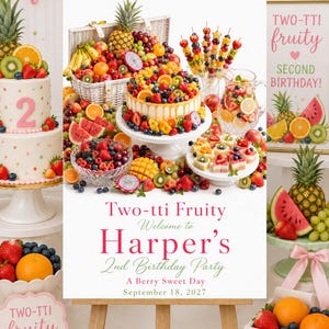 May include: A rectangular sign on a wooden easel featuring the text Two-tti Fruity Welcome to Harper's 2nd Birthday Party A Berry Sweet Day September 18, 2027. The image displays a cake, fruit skewers, a pitcher of fruit, and a basket of fruit.
