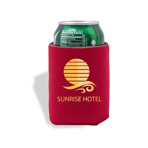 May include: Red neoprene can cooler with a gold sun and wave design and the text "SUNRISE HOTEL".