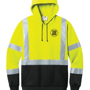 May include: High-visibility yellow and black hooded sweatshirt with reflective silver stripes. Features a front pocket and a hood. The text "YOUR LOGO HERE" is printed on the chest. This safety apparel is designed for enhanced visibility.