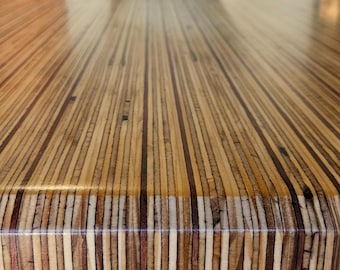 Tafla Lapis Gemcut 8-10-person wooden dining table in a unique style with a high-quality cast epoxy finish. Handmade in the Netherlands.