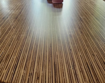 Tafla Lapis Oval 8-10-person wooden dining table in a unique style with a high-quality cast epoxy finish. Handmade in the Netherlands.