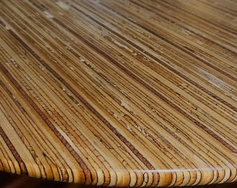Tafla Lapis Oval 8-10-person wooden dining table in a unique style with a high-quality cast epoxy finish. Handmade in the Netherlands.