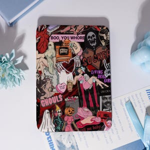 May include: A rectangular sticker sheet with a collage of spooky illustrations. The design features ghosts, skulls, and vintage comic book art. Text includes "BOO, YOU WHORE", "SUCKER", and "FREAK". The color palette is primarily red, black, and pink.