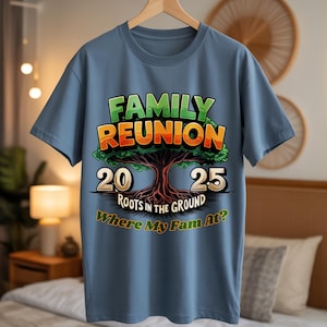 May include: A blue t-shirt with a graphic design for a family reunion. The design features the words "FAMILY REUNION" in green and orange, a tree illustration, and the numbers "20" and "25". The text "ROOTS IN THE GROUND" and "Where My Fam At?" are also included.