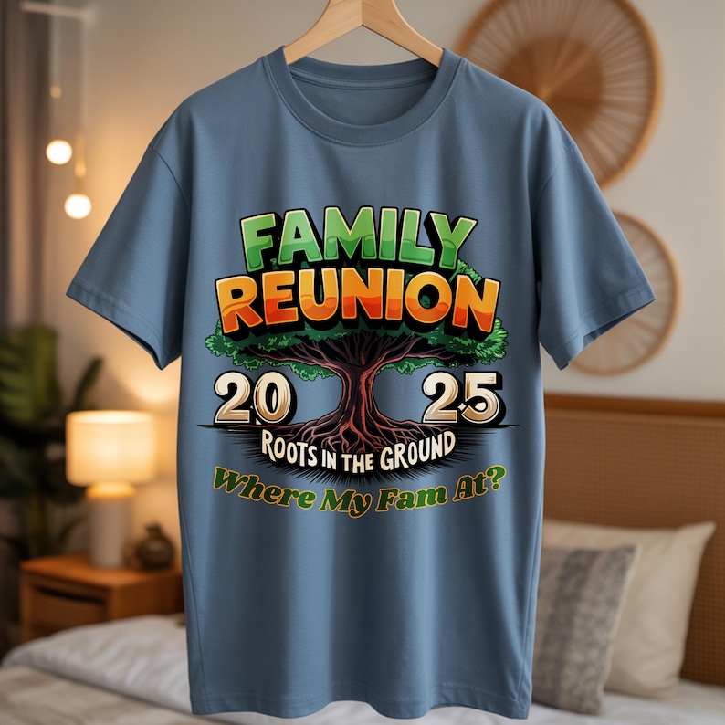 May include: A blue t-shirt with a graphic design for a family reunion. The design features the words "FAMILY REUNION" in green and orange, a tree illustration, and the numbers "20" and "25". The text "ROOTS IN THE GROUND" and "Where My Fam At?" are also included.
