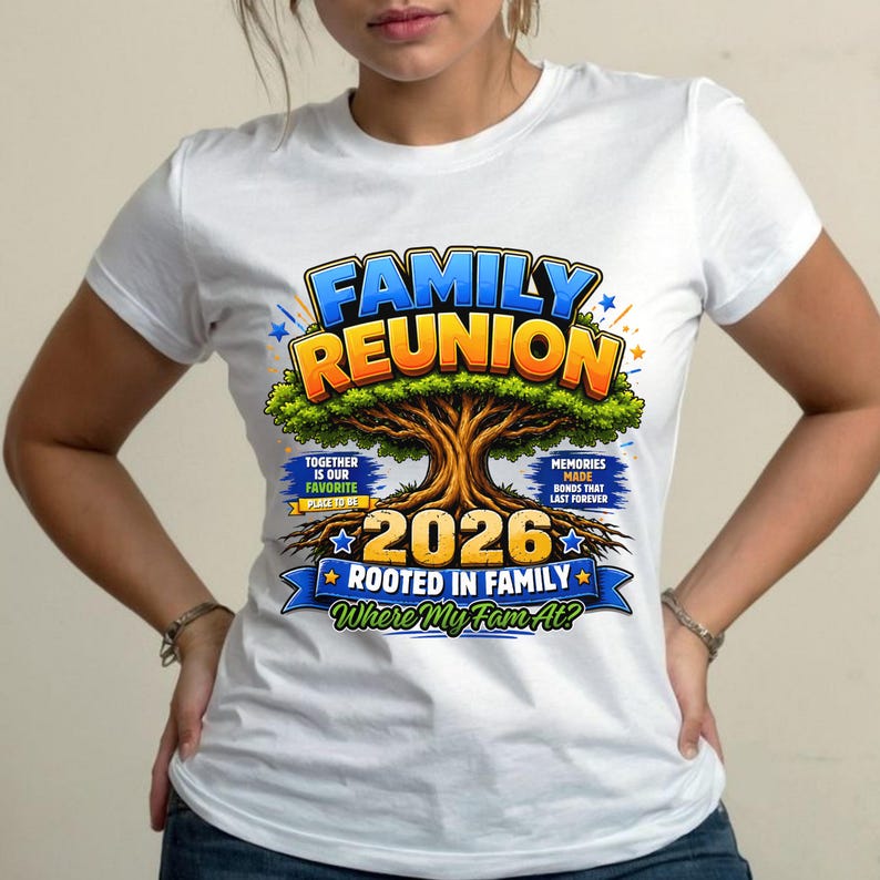 May include: White t-shirt featuring a colorful graphic for a family reunion. The design includes the words "Family Reunion" in blue and orange, a tree illustration, the year "2026", and the phrase "Rooted in Family".
