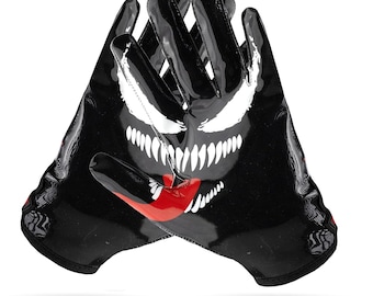 May include: Black and red football gloves with a white Venom graphic. The gloves have a textured surface and a black and red design.