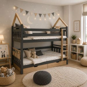 May include: A dark gray and light wood bunk bed with a house-shaped frame, featuring a built-in ladder, two lower storage drawers, and protective side rails. The bed is dressed with white bedding, neutral-toned pillows, and a small hanging storage organizer.