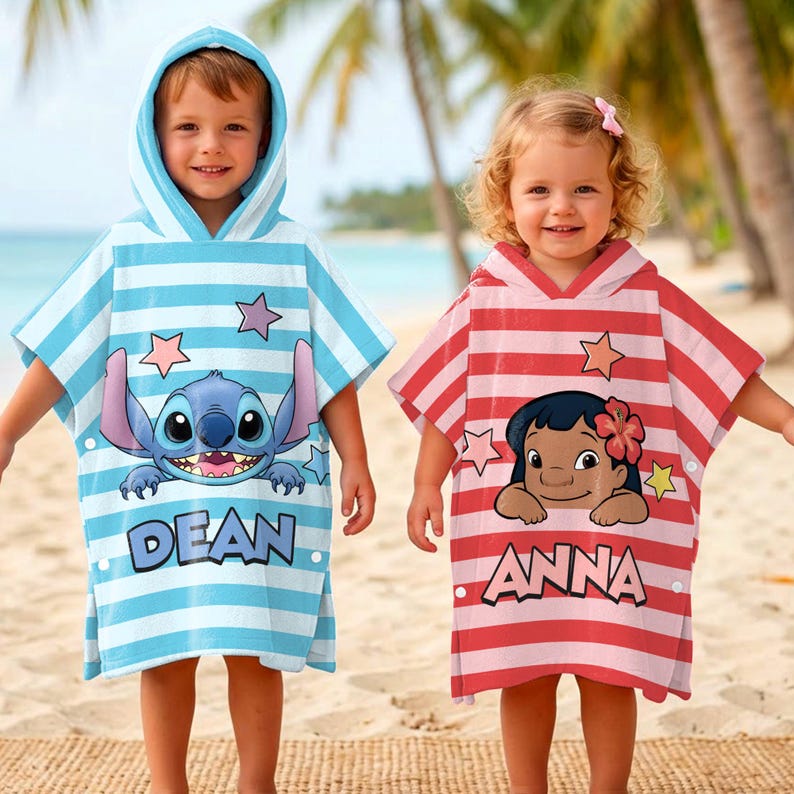 May include: Two children wearing hooded beach towels. One towel is light blue with horizontal stripes, a Stitch graphic, and the name "DEAN". The other is red and white striped with a Lilo graphic and the name "ANNA".