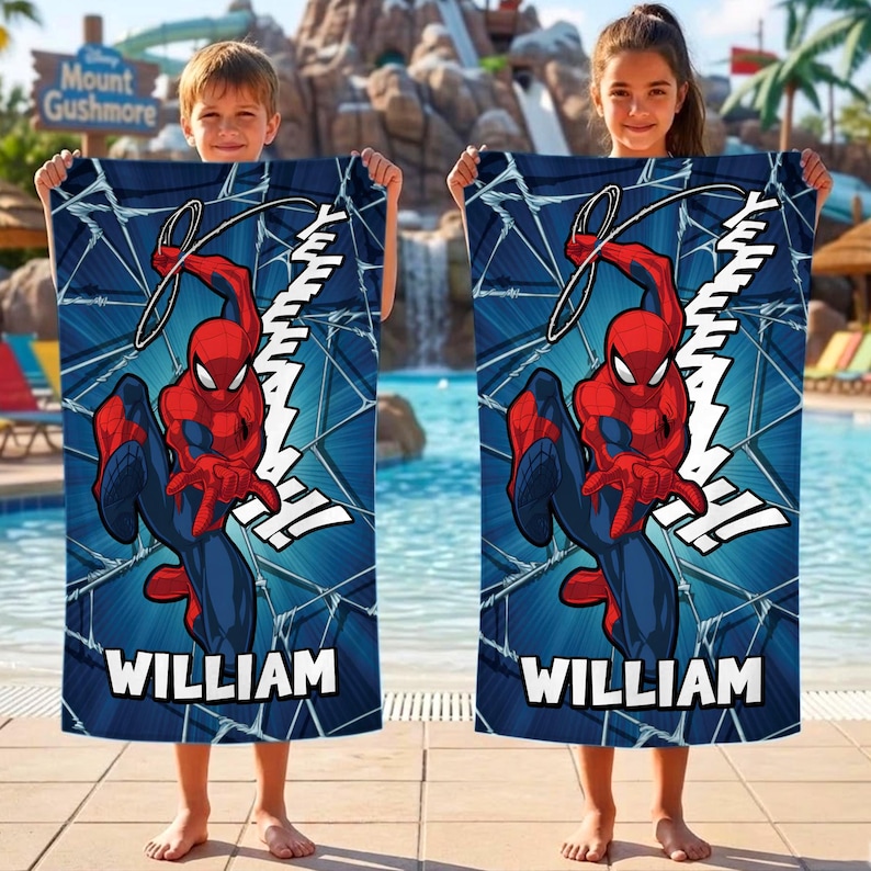 May include: Two blue beach towels featuring Spider-Man in a dynamic pose, with the word "WILLIAM" printed at the bottom. The towels have a web-like pattern and the word "YEEAAAH!" in white.