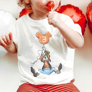 May include: A set of three ceramic mugs with a speckled, matte finish. The mugs are in shades of cream, light gray, and dark gray. Each mug has a simple, minimalist design, perfect for coffee or tea.