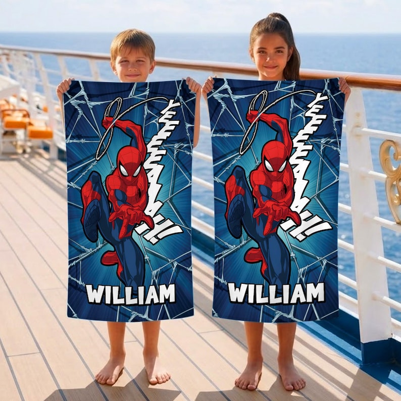 May include: Two beach towels featuring the superhero Spider-Man. The towels have a blue background with a web design and a graphic of Spider-Man in his red and blue suit. The name "WILLIAM" is printed on each towel.