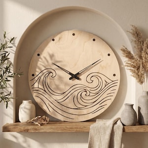May include: A round wooden wall clock with a natural finish. The clock features black hands and a wave design etched into the lower half. The clock is approximately 12 inches in diameter.