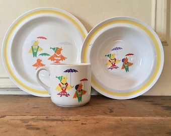 1960s Arabia Finland 3pc Childrens Set, Peukaloinen - yellow rim, birds + umbrellas - plate + bowl + cup