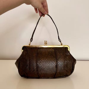 Vintage Brown Textured Frame Bag with Gold Hardware and Structured Shape
