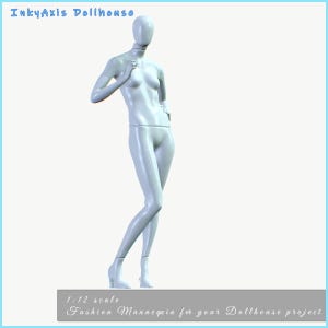 May include: A white, 1:12 scale fashion mannequin for dollhouse projects. The mannequin is in a standing pose, with one arm raised and the other at the hip. The text "InkyAxis Dollhouse" is at the top, and "Fashion Mannequin for your Dollhouse project" is at the bottom.