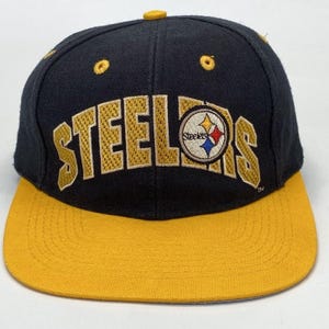 Gorra snapback de los Pittsburgh Steelers con visera plana de dos tonos, de Drew Pearson