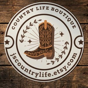 May include: A round sticker with a brown and tan cowboy boot design. The text "COUNTRY LIFE BOUTIQUE" is in a circular pattern around the boot. The Etsy shop name "jscountrylife.etsy.com" is also included.