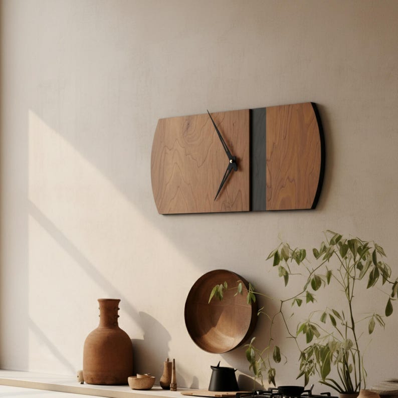 May include: A rectangular wooden wall clock with a dark gray stripe down the center and black hands. The clock has rounded edges and is mounted on a light-colored wall. The clock's dimensions are approximately 24 inches long and 12 inches wide.