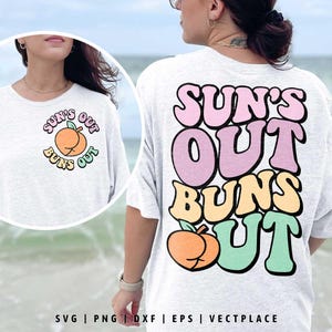 May include: A white t-shirt with a peach graphic and the text "Sun's Out Buns Out" in pink, yellow, and green lettering.