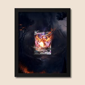 May include: Framed artwork featuring a Pokémon trading card with a fiery Charizard design. The card is set against a dark, dramatic background with hints of orange and red flames. The black frame adds a sleek finish.