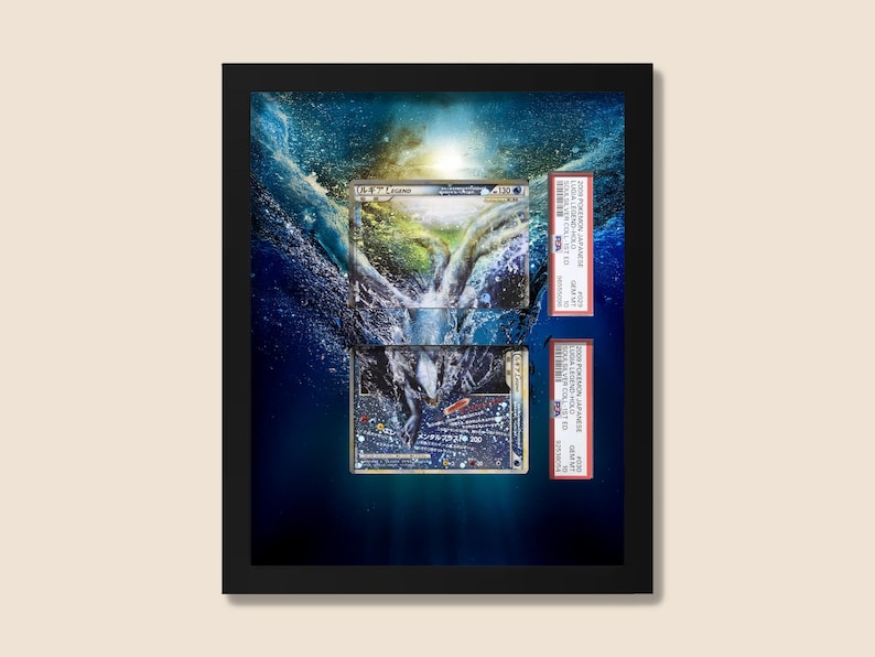 May include: Framed artwork featuring two collectible trading cards submerged in water. The cards are encased in protective holders with text. The background is a digitally created underwater scene with blue and white hues.