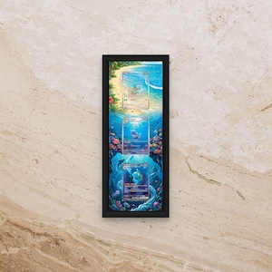 May include: A vertical black rectangular frame containing three stacked trading cards featuring Squirtle, Wartortle, and Blastoise. The background art behind the cards depicts a continuous underwater and beach scene with blue water, coral, and sand.