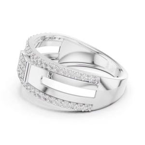 May include: A silver ring with a rectangular center and a band lined with small, clear stones. The ring has a modern design with a polished finish and a small, stylized letter "R" on the side.