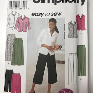 May include: A sewing pattern for women's clothing, including a white blouse, a black and white patterned waistcoat, a green skirt, a pair of black culottes, and a pair of white trousers. The pattern is from Simplicity and is labelled "easy to sew".