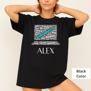 May include: Black t-shirt with the name "ALEX" in white block letters. Above the name is a word cloud design with the words "Database Administrator" in teal and other related terms in white.