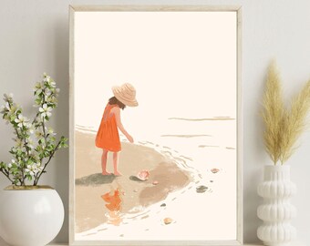 May include: A framed art print depicts a child in an orange dress and straw hat on a beach, reaching for a seashell. The artwork has a soft, watercolor style with muted tones of beige, orange, and brown. The print is displayed on a white shelf with decorative vases.