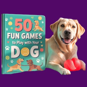 May include: A golden Labrador Retriever smiles next to a book titled "50 Fun Games to Play with Your Dog." The book is teal with illustrations of dogs and paw prints. A red chew toy rests near the dog.