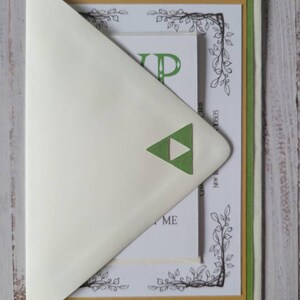 Zelda Wedding Invitation | Green Cardstock with Gold Hyrule Crest on Back | Ivory Envelope with Green Triforce Diecut | RSVP Card with Rupees | Reception Card | Ivory RSVP Card
