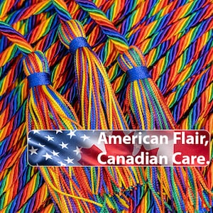 May include: Close-up of colorful tassels with a rainbow of hues, including red, orange, yellow, green, blue, and purple. Each tassel is bound with a blue band. The image includes text that reads "American Flair, Canadian Care."