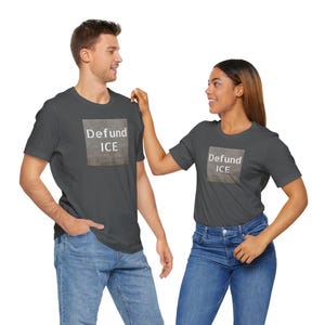 Make your voice heard against ICE with this unisex soft cotton tee that combines activism with compassion.