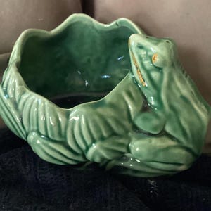 May include: A set of three ceramic mugs with a speckled, matte finish. The mugs are in shades of cream, light gray, and dark gray. Each mug has a simple, minimalist design, perfect for coffee or tea.