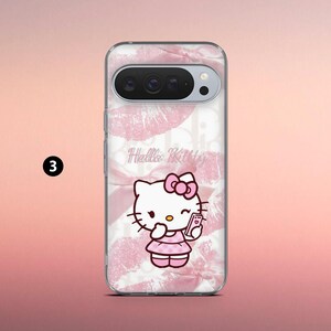 May include: Clear phone case featuring a pink and white design with a Hello Kitty graphic. The case has a pink bow and kiss print. The Hello Kitty character is holding a phone. The phone case is designed for a smartphone.