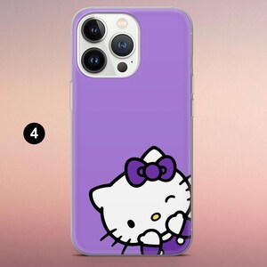 May include: A purple smartphone case featuring a graphic of a white Hello Kitty character with a dark purple bow. The character is positioned at the bottom right corner of the case. The camera lens array is visible at the top left of the device.